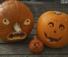Üç Halloween pumpkins farklı yüzlerle